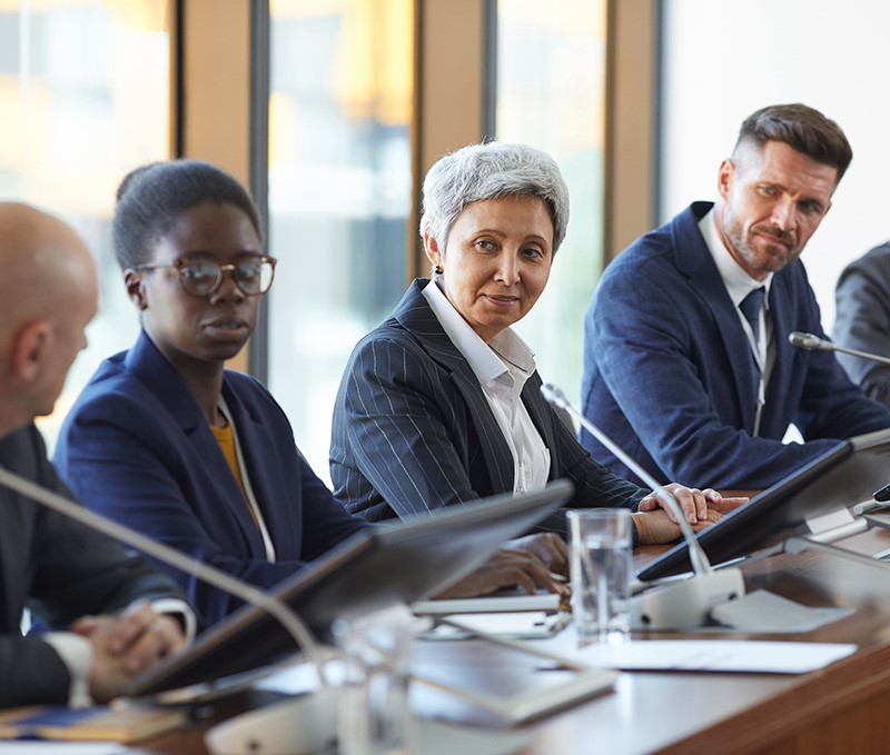 men and women in a meeting